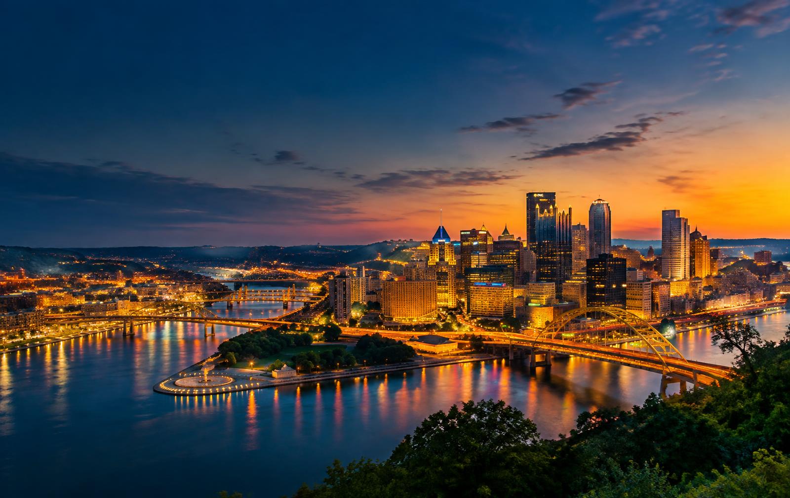 Pittsburgh skyline and bridges above the three rivers at sunset
